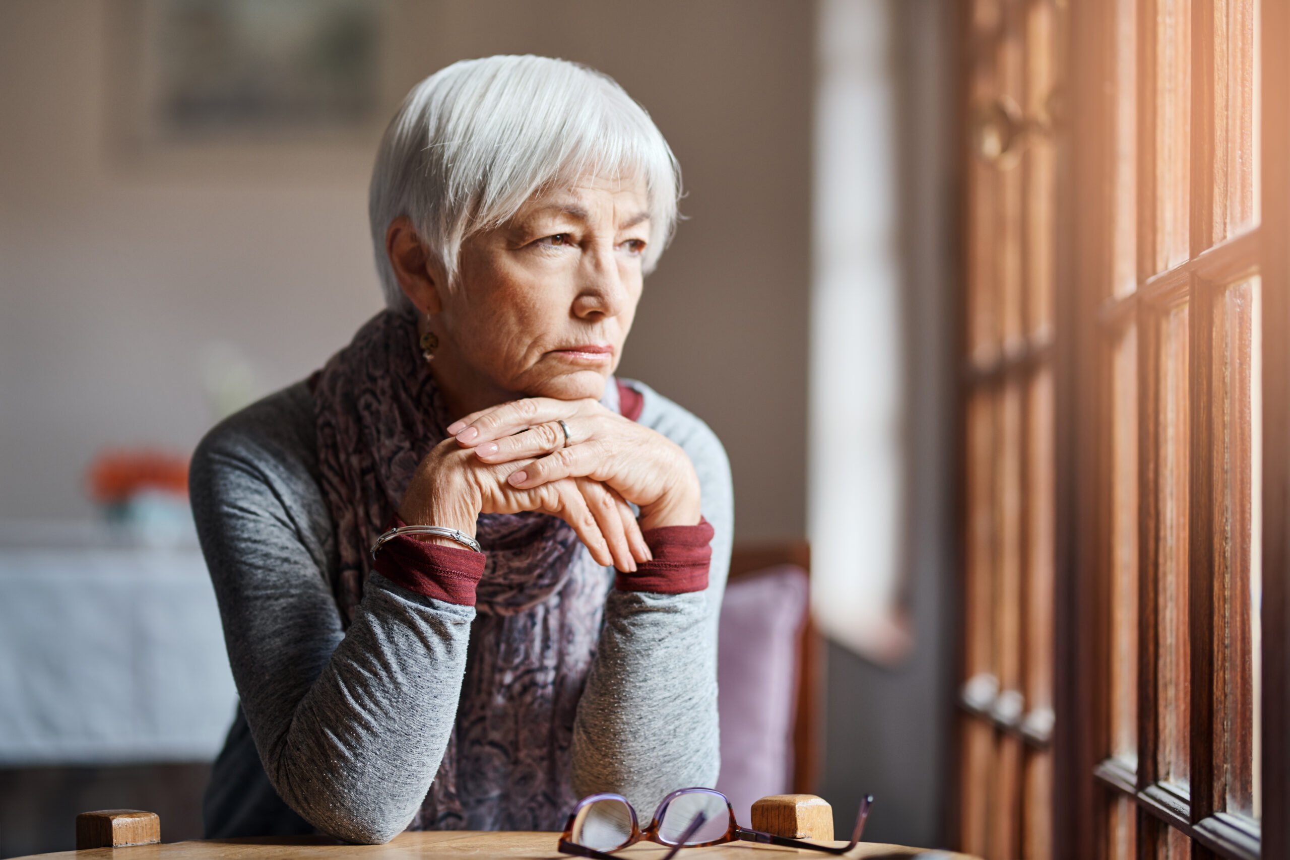 senior looking thoughtful