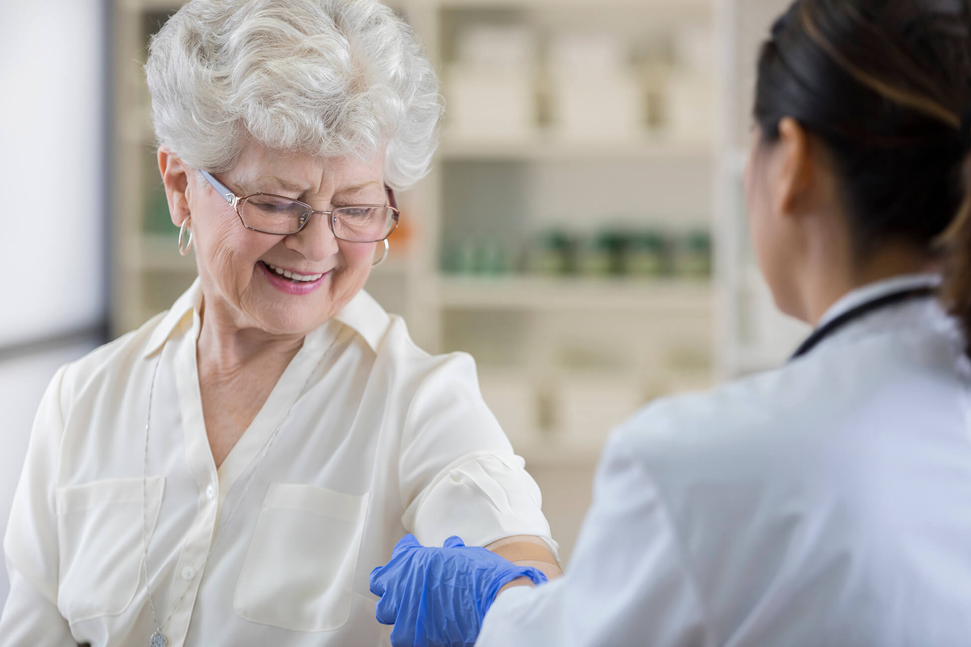 senior woman getting flu shot